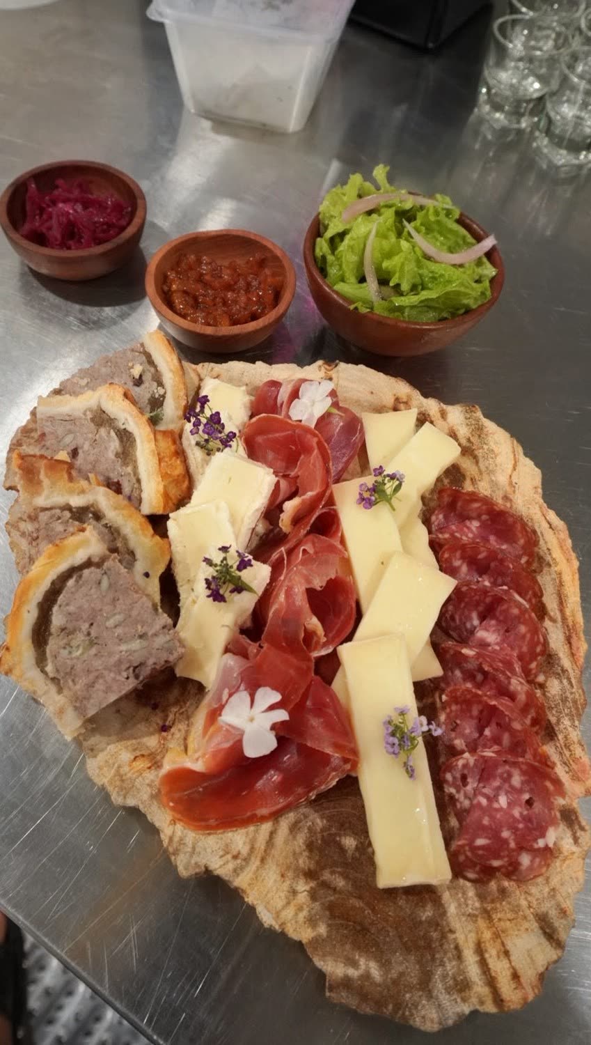 Cheese and charcuterie board with cured meats and bread