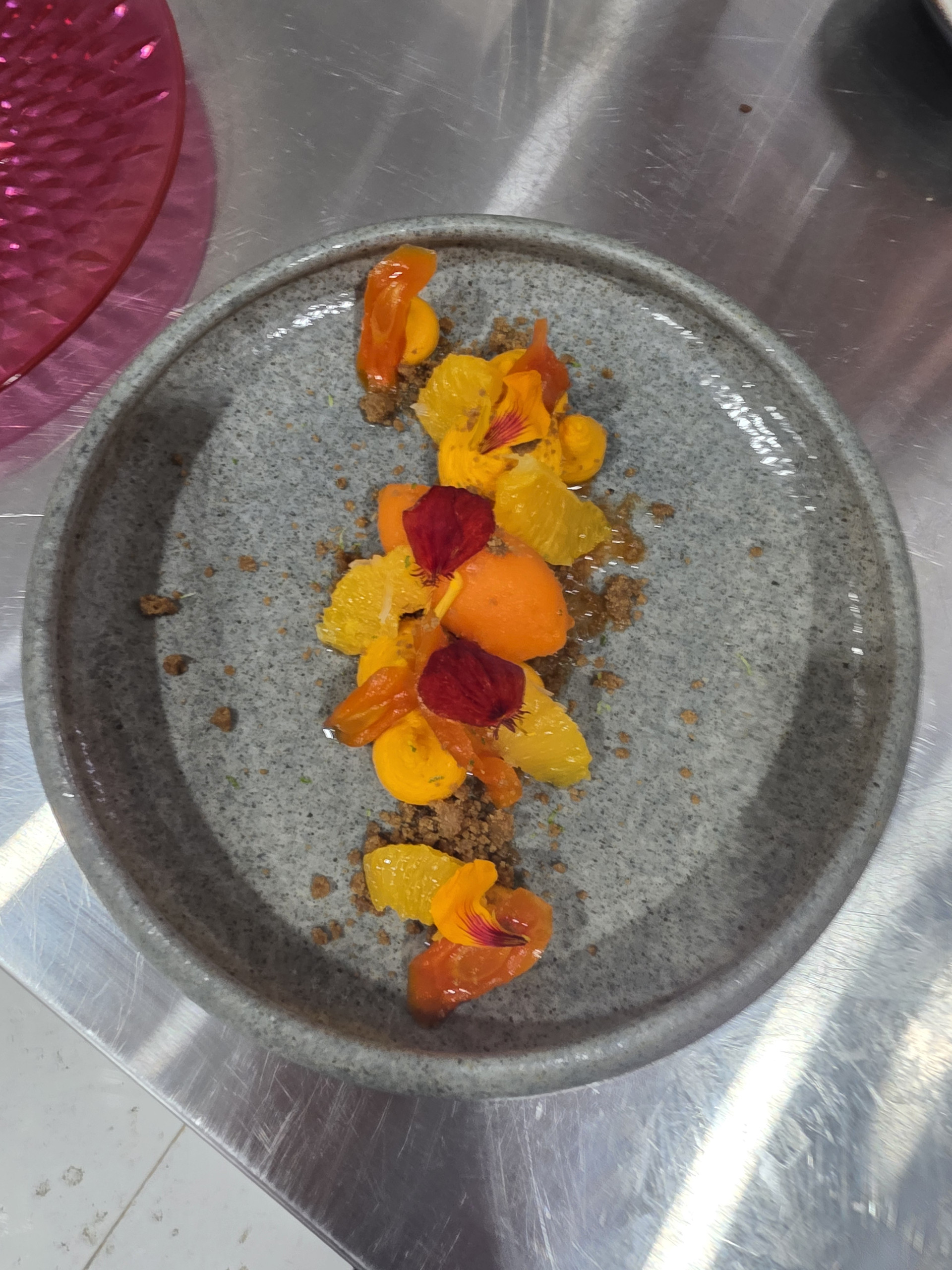 Root Harmony: candied carrot and ginger on a grey stone plate