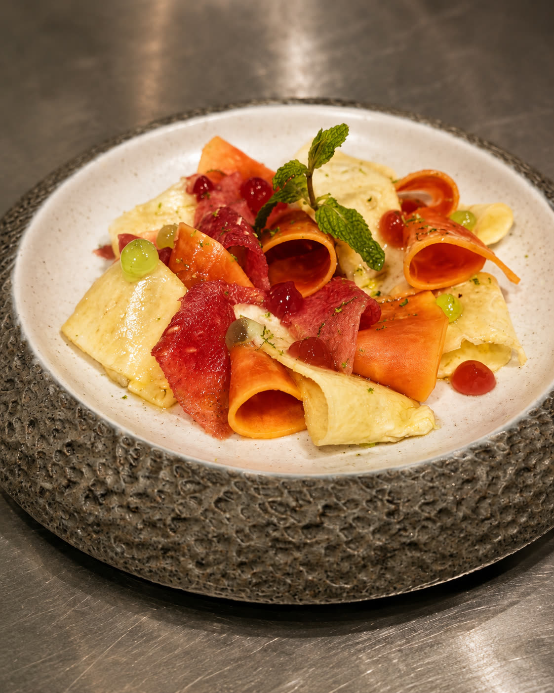Seasonal tropical fruit plate with lemongrass and hibiscus gels